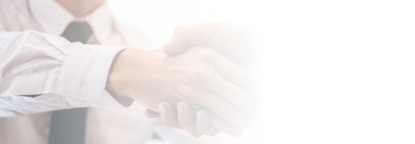 Two men shaking hands over a deal